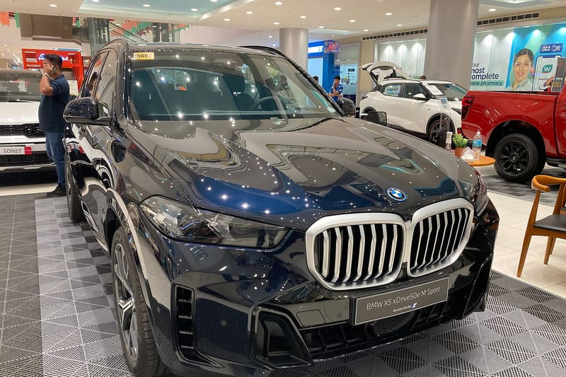 BMW iX5 at a fast-charging station