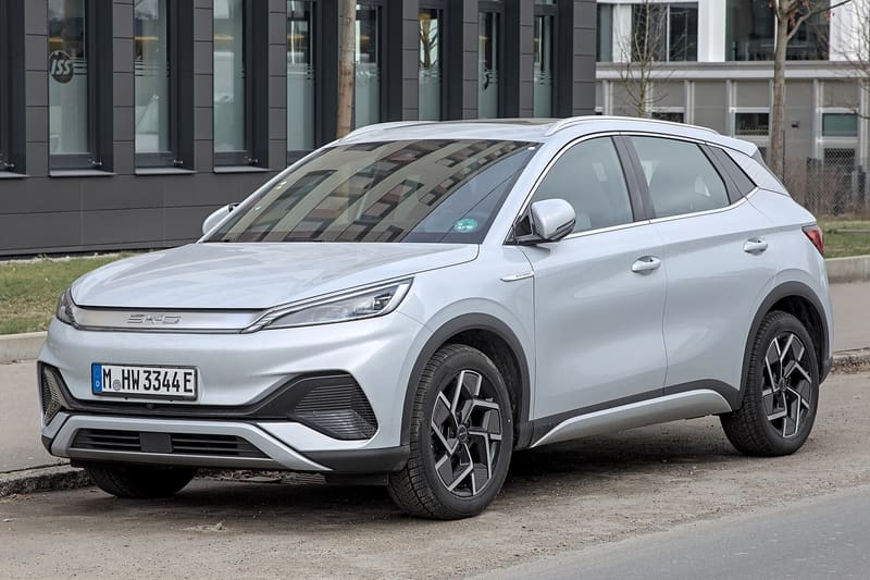 Customers viewing Chinese-brand cars on an Irish dealership forecourt.